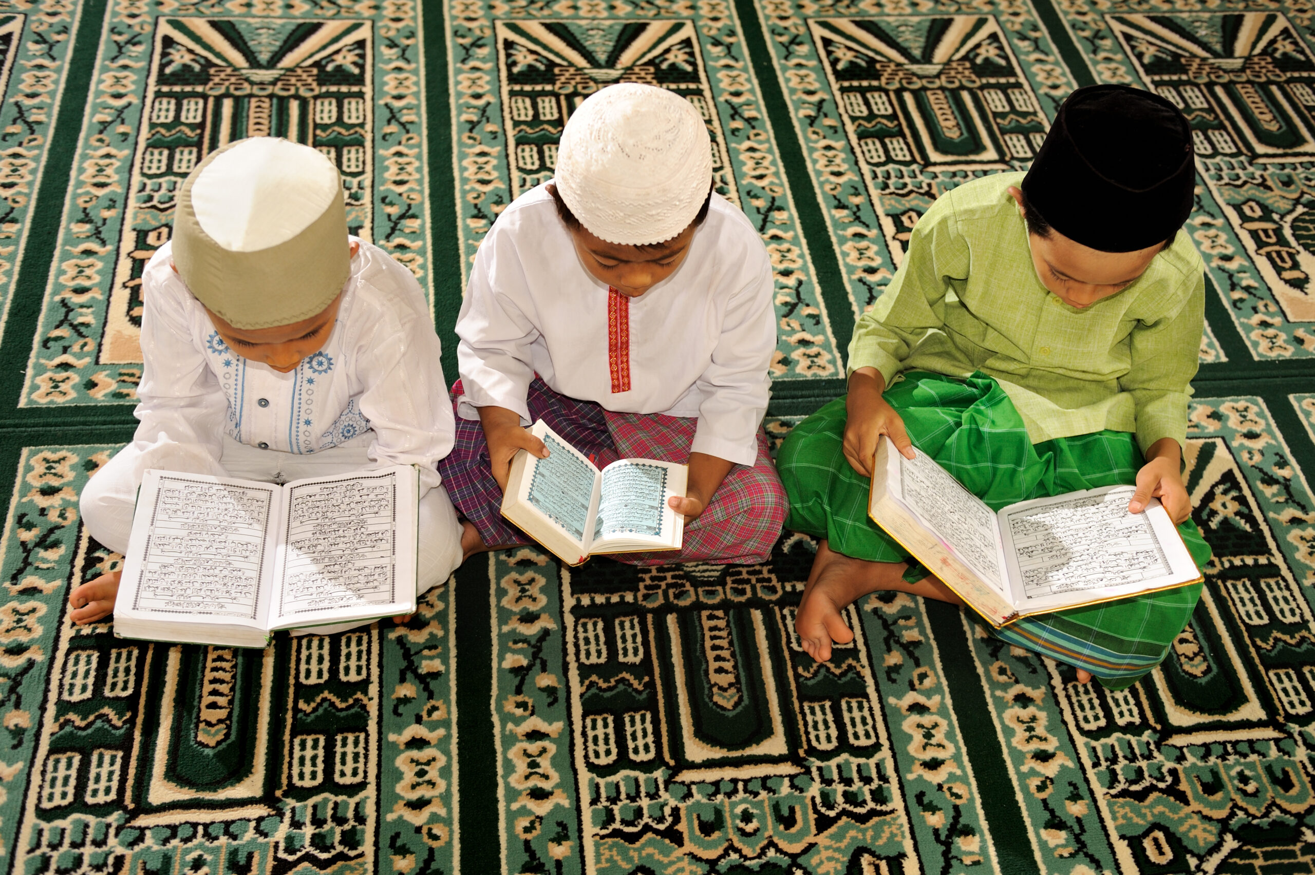 Muslim Kids Reciting Koran in a Mosque