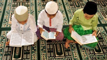 Muslim Kids Reciting Koran in a Mosque
